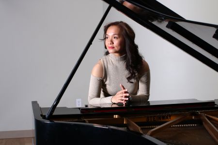 Lynn Yew Evers prepares to play her upcoming concert.